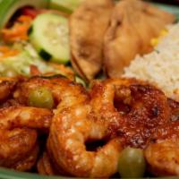 Tinga De Camaron · Grilled shrimp served on a bed of tomato, exotic chipotle peppers and onions. Accompanied by...