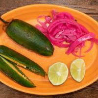 Chiles Toreados · (2) Flame roasted whole jalapeño peppers served with lime wedges and marinated red onions.