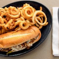 Philly Cheesesteak · Steak or chicken grilled onions and cheddar cheese.