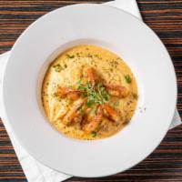 Creole Shrimp & Cheese Grits · Tender grilled shrimp , sweet peppers & onions served on top of  Cajun cream sauce cheese gr...