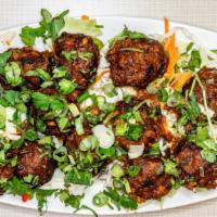 Veg Manchurian · Fried dumplings made of cabbage, carrots & other vegetables and then sautéed inchef made Man...