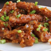 Babycorn Manchurian · Babycorn stir-fried in sweet and spicy sauce, served dry.