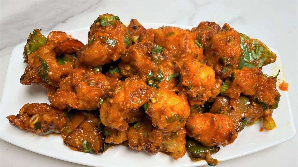 Chilli Gobi · Battered egg marinated with desi spices and then tossed in spicy chilli sauce.