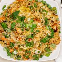 Wok Tossed Fried Rice(Streetstyle) · Indo Chinese Style Fried rice cooked in a special schezwan sauce with a choice of mixed vegg...