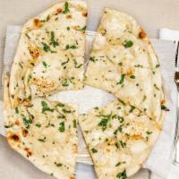 Garlic Naan · Bread baked in tandoor grill and topped with garlic and  butter.