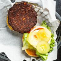 Veggie Burger · A quarter pound all vegetable black bean patty topped with your choice of cheese, lettuce, t...