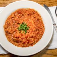 Jambalaya · A spicy blend of shrimp, andouille sausage, mushrooms, and tomato herb sauce. Served with ri...