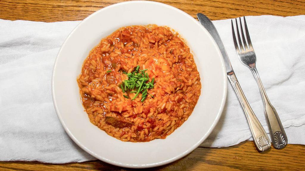 Jambalaya · A spicy blend of shrimp, andouille sausage, mushrooms, and tomato herb sauce. Served with rice.