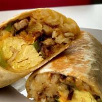 Flynn'S Signature Breakfast Burrito · Two scrambled eggs, hashbrown, crispy bacon, chorizo, avocado, veggies, and cheese in a fres...