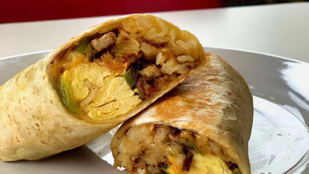 Flynn'S Signature Breakfast Burrito · Two scrambled eggs, hashbrown, crispy bacon, chorizo, avocado, veggies, and cheese in a fresh flour