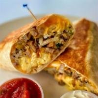 Spicy Hot Breakfast Burritto · Two scrambled eggs, hashbrown, jalapeños, sriracha, and melted cheese wrapped in a fresh flo...