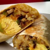 New York Breakfast Burritto · Two scrambled eggs, hashbrown, corn beef, caramelized onions, and melted cheese wrapped in a...