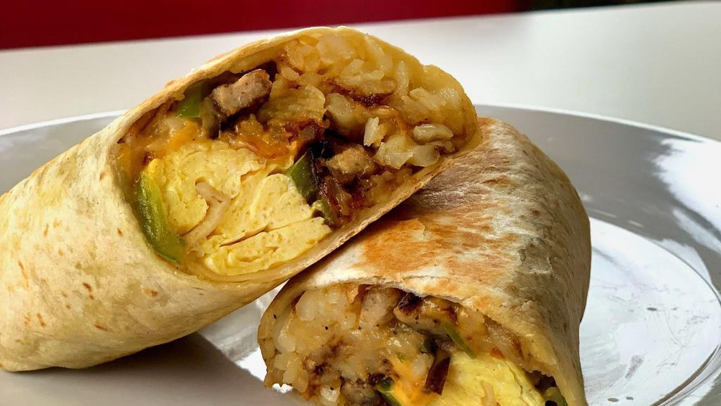 New York Breakfast Burritto · Two scrambled eggs, hashbrown, corn beef, caramelized onions, and melted cheese wrapped in a fresh flour tortilla.