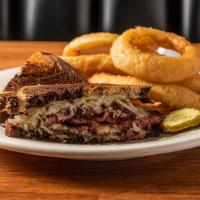 Reuben · Our signature thick-cut corned beef, sauerkraut and swiss cheese, on grilled marble rye.