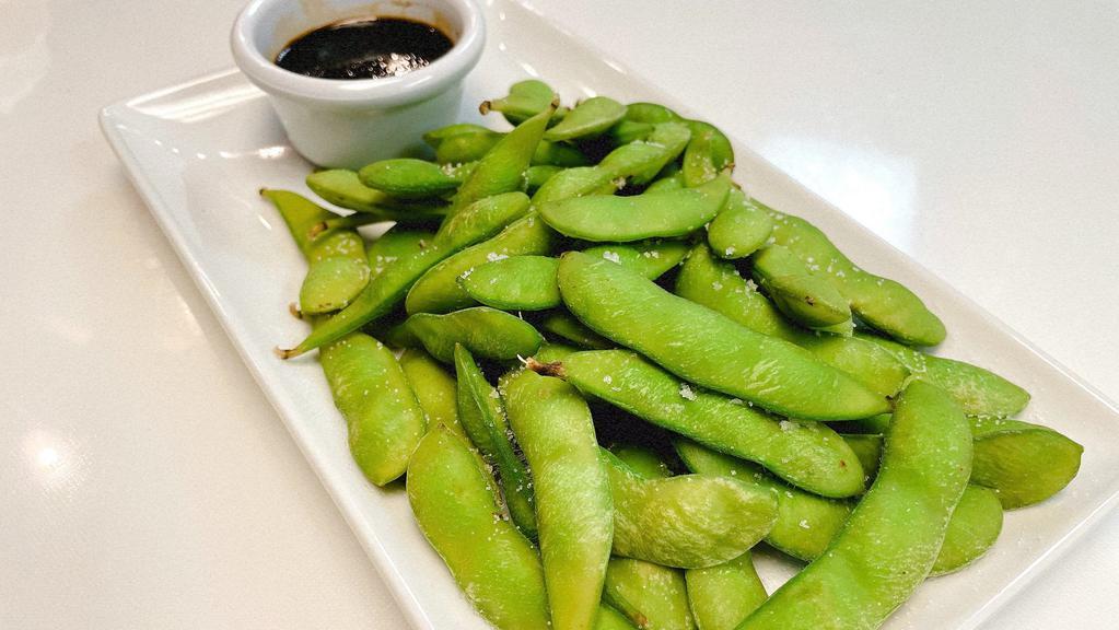Edamame · Steamed and seasoned edamame served with sweet soy sauce.