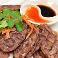 Cold Stewed Beef Slices · Spicy. Chilled stewed beef cut into slices served with our soy sauce and chili oil garnished...
