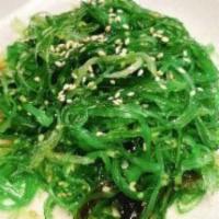 Seaweed Salad · Spicy. Seaweed topped with agar, crushed chili pepper, cucumbers, lettuce, sesame seeds, and...