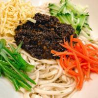 Soybean Paste Noodles · Noodles topped with shredded carrots, cucumbers, egg crepe, green onions, and our special st...