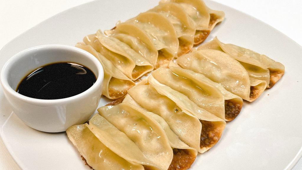 Pan-Fried Pork Pot Stickers (12 Pieces) · Pot stickers with ground pork, napa cabbage, and special seasonings filling.