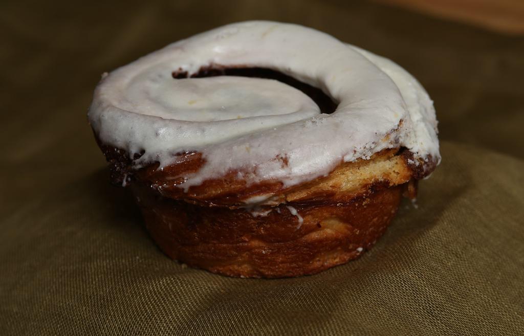 Cinnamon Roll With Icing · A warm cinnamon roll frosted with cream cheese icing.