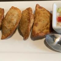Curry Puffs · Vegetarian. Deep-fried savory vegetarians mix of potato, onion, and yellow curry powder. Wra...