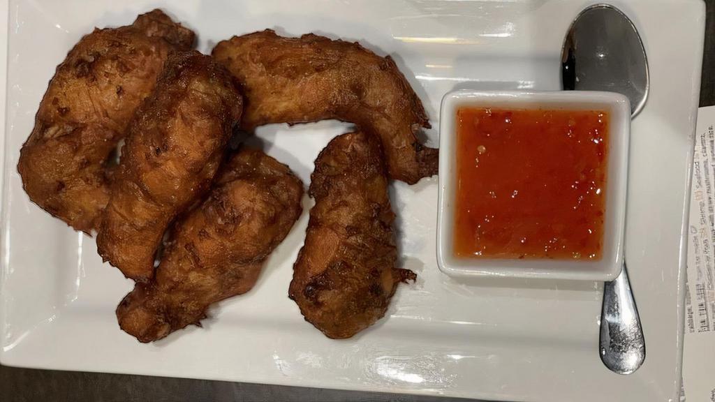 Chicken Wings · Fried wings with a sweet chili dip.