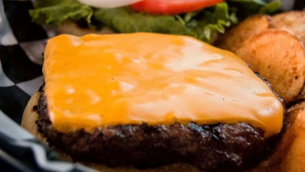 Sully'S Burger · Half-pound ground brisket burger cooked to a perfect medium, served with or without checker-board cheese (American and Swiss).