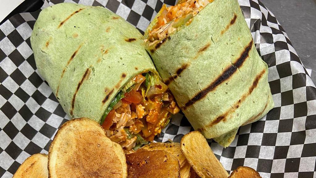Buffalo Chicken Wrap · Grilled chicken breast tossed in hot buffalo sauce and served with lettuce, tomato, celery and blue cheese crumbles.