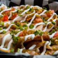 Irish Nachos · Choice of homemade hand-sliced chips or fresh-cut fries, smothered with white cheese sauce a...