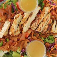 Large Fattoush Tawook · Juicy grilled chicken with garden salad topped with crunchy toasted pita bread, and Boostan ...