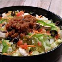 Veggie Salad · Lettuce, tomatoes, onions, green peppers, mushrooms, black olives, Cheddar cheese.