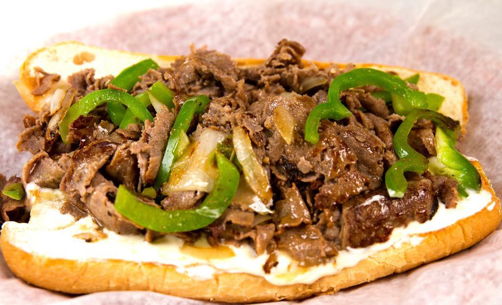 Creamy Philly Cheese Steak · Steak or chicken, onions, green peppers, and cream cheese on an amoroso hoagie.