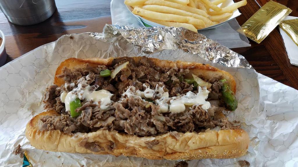 Blackened Philly Cheese Steak · Spicy. Steak or chicken, onions, green peppers, white American cheese, and blackened seasoning on an amoroso hoagie.