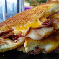 Bacon Grilled Cheese On Texas Toast · Smoked Applewood Bacon, Wisconsin Mozzarella, American & Cheddar on Thick-Cut Turano Texas T...