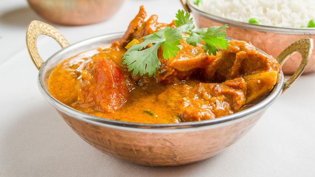 Lamb Curry · Lamb cooked with herbs and spices in gravy sauce.