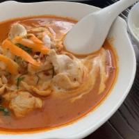 Panang Curry · Spicy. Panang curry paste cooked with coconut milk top with kaffir lime leaf. Add shrimp for...