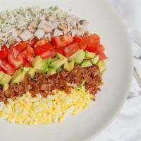 Chopped Cobb Salad · A classic cobb salad chopped up and piled high with greens, grilled chicken, avocado, tomato...