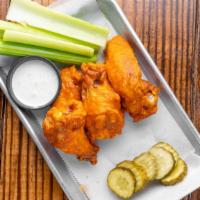 City Chicken Wings · Deep-fried and tossed in your choice of sauce or dry rub.