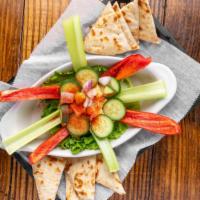 Hummus · House-made hummus and cucumber salad served with cucumber, celery, red pepper, and warm pita.