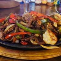 Fajita De Asada Y Camaron  · Skirt steak & Shrimp fajita grilled with caramelized onions, tomato, and bell pepper. Served...