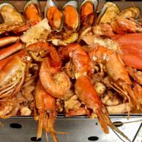 Rompe Colchones Parillada · Shrimp, fish, clams, octopus, prawns, and crab legs.  Served with choice of rice & beans or ...