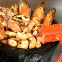 Levanta Muertos Molcajete · Shrimp, fish, octopus, mussels, and crab legs. Served with choice of side.