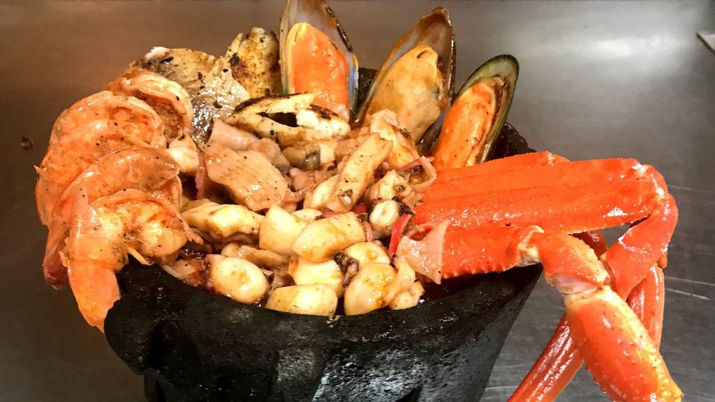 Levanta Muertos Molcajete · Shrimp, fish, octopus, mussels, and crab legs. Served with choice of side.