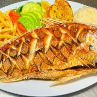 Huachinango Frito · Fried red snapper. Served with choice of rice & beans, salad garnish, garlic bread or tortil...
