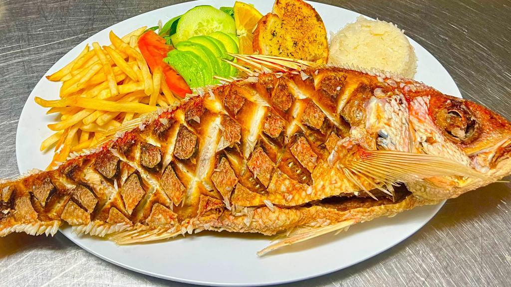 Huachinango Frito · Fried red snapper. Served with choice of rice & beans, salad garnish, garlic bread or tortillas.