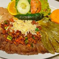 Carne Nortena  · Skirt Steak with chorizo mixed with jalapeño topped with cheese. Served with side of rice & ...