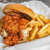 Nashville Chicken Sandwich  · Crispy chicken served with our signature glaze, pickles and slaw on a brioche bun.