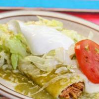 Enchiladas Verdes · 3 chicken enchiladas covered with green sauce topped with sour cream served with rice and be...
