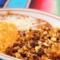 Huevos Con Chorizo · Scrambled eggs with chorizo (Mexican sausage). Served with rice and beans.