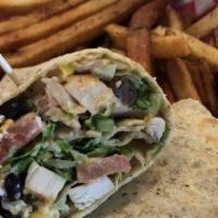 Southwest Chicken Wrap · Blackened chicken, lettuce, black bean and corn salsa, shredded cheese, and our house-made c...